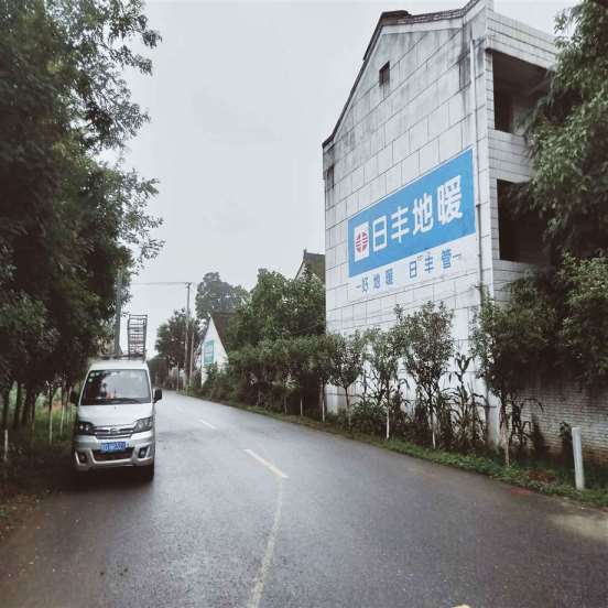 伊犁喷墙体广告,伊犁驾校墙体广告城市带动农村